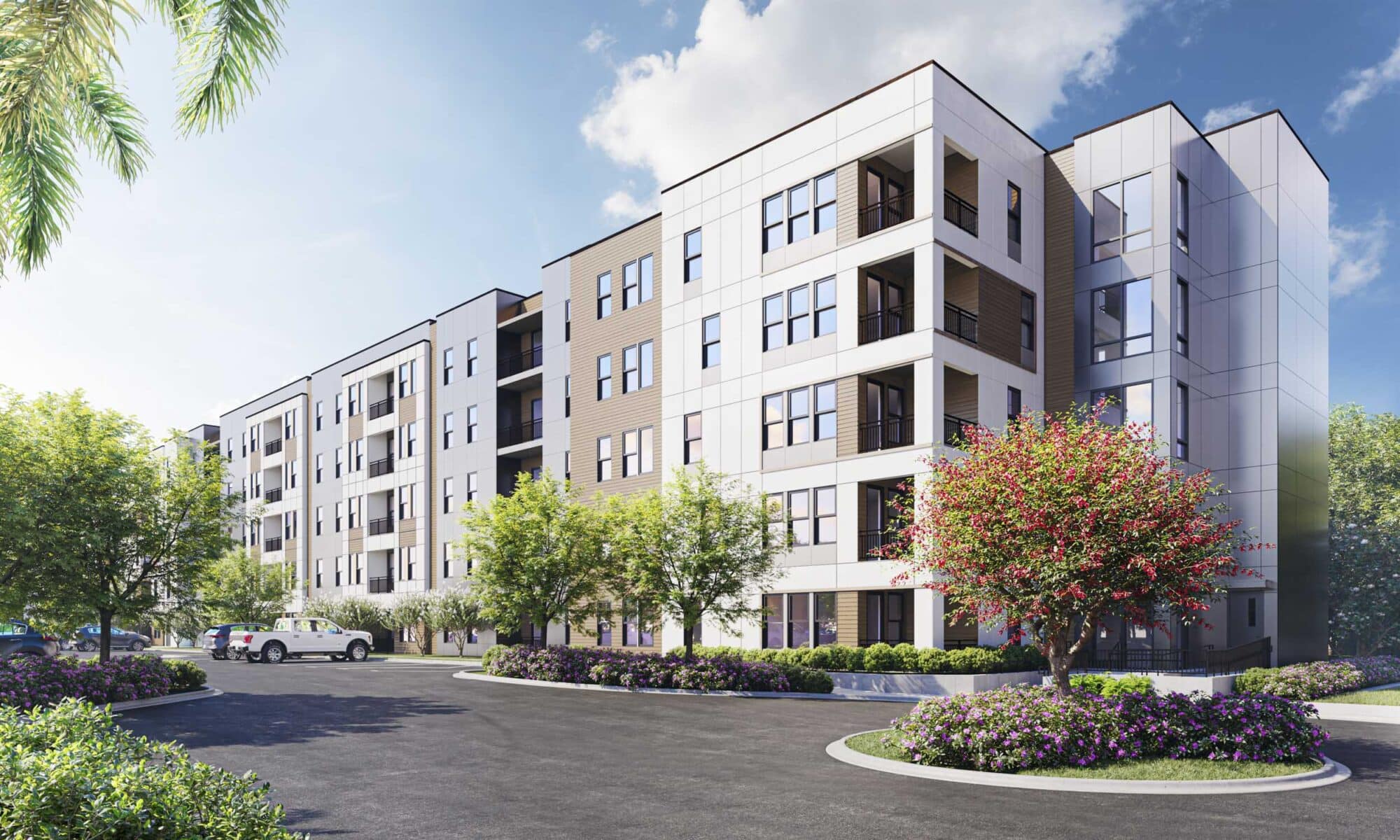 white gray and brown midrise apartment building exterior surrounded by blooming trees